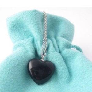 Authentic Tiffany and Co solid onyx heart w/chain
